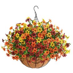 a hanging basket filled with lots of colorful flowers