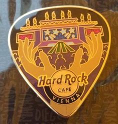 the hard rock cafe logo is shown on a guitar picker's back plate