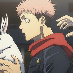 an anime character holding a rabbit in his hand and another person reaching out to touch it