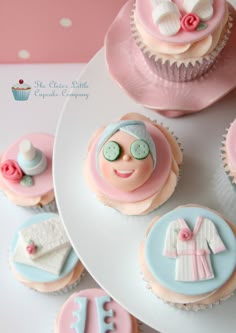 cupcakes decorated with pink and blue frosting