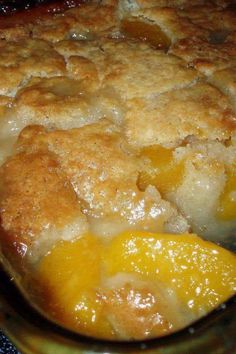 a close up of a pie in a pan on a stove top with oranges