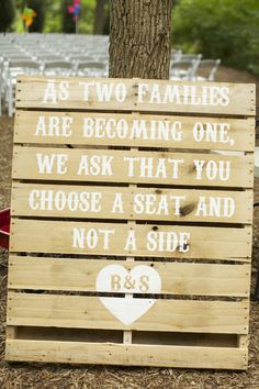 a wooden sign that says as two families are becoming one, we ask that you choose a seat and not a side