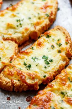 cheesy bread with cheese and parsley on the top is ready to be eaten