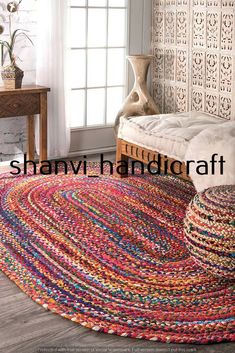 a colorful rug in the corner of a room with a bed and window behind it