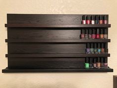 a shelf that has some nail polish on it