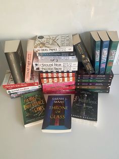 a pile of books sitting on top of a table