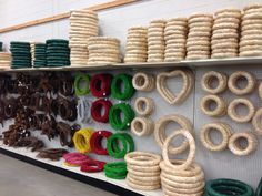 the shelves are filled with different kinds of bracelets and necklaces on display for sale