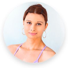 a woman with large hoop earrings is looking at the camera