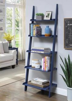 a blue leaning shelf with books on it