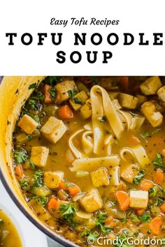 a bowl filled with tofu noodle soup on top of a table