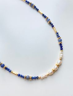 Lapis Lazuli Necklace with Baroque Pearls, Pearl Choker, Real Pearl Necklace with Sodalite, Beaded Necklace y2k, Gift for Mom, y2k Jewelry, Raw Gemstone Necklace, Plus Size Choker, Raw Crystal Necklace with Fresh Water Pearls, y2k Necklace ♥ Useful Quick Notes * This colorful crystal necklace is prepared with gold-plated beads, blue Lapis Lazuli crystal beads, big blue Sodalite crystal beads and fresh water pearls. * The finish is also made with a gold-plated chain and a gold-plated lobster claw Lapis Lazuli Beaded Necklace, Gold And Blue Jewelry, Blue Pearl Necklace, Mixed Beads Necklace, Y2k Necklace, Fancy Jewelry Necklace, Y2k Jewelry, Real Pearl Necklace, Lapis Necklace