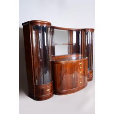 an art deco display cabinet with mirrored doors