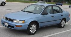 a blue car parked in a parking lot