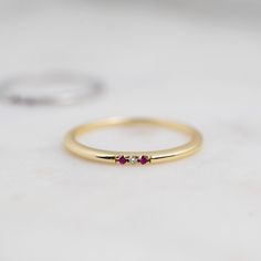 Minimalist Ruby Birthstone Promise Ring, Minimalist Ruby Ring With Birthstone, Minimalist Ruby Ring Birthstone, Minimalist Ruby Promise Ring With Round Band, Minimalist Ruby Promise Ring, Dainty Ruby Ring, Layering Diamond Necklaces, Star Ruby Ring, 3 Stone Diamond Ring