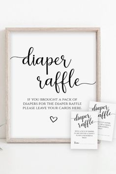 a sign that says diaper raffle and two tags