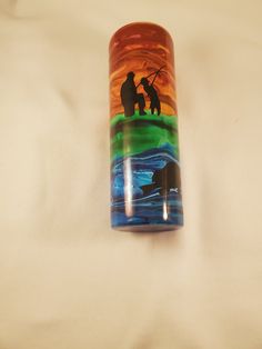 a glass tube with an image of two people fishing