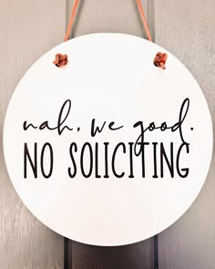 a white sign that says, nab we need no soliciting on it