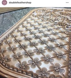 a close up of a table cloth with flowers on it