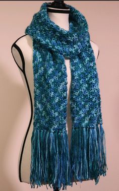 This soft, lovely scarf will add a pop of colour to even the gloomiest day! Purchase this scarf for a special person in your life, or treat yourself to this beautiful blue delight. Care Instructions: This scarf is 100% acrylic and can be hand washed or machine washed in warm water on the delicate cycle. Tumble dry on low heat. Do not bleach, iron, or dry clean. This item was crafted in a smoke free, pet free home. Note: custom orders always welcome. 🙂 Blue Knitted Scarves For Winter, Blue Knitted Winter Scarves, Blue Knitted Yarn Scarves, Blue Crochet Scarves For Winter, Blue Knitted Yarn Scarf, Handmade Blue Shawl For Winter, Blue Knitted Scarves One Size, Blue Knitted One-size Scarf, Blue Knitted Scarf One Size