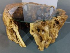 a wooden table with glass top on display