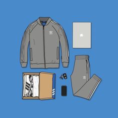 the contents of a men's adidas outfit laid out on a blue background