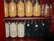 the shelves are filled with different types of jars