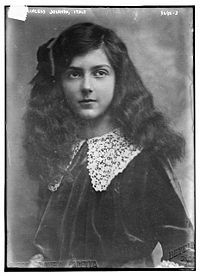 an old photo of a woman with long hair