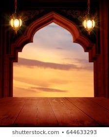 an open door with a sunset in the background