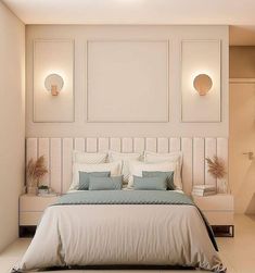 a bedroom with white walls and blue pillows