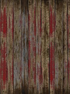 an old wooden wall with red paint on it