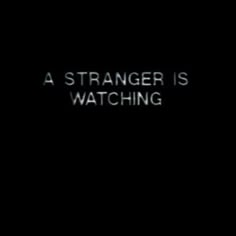 a black background with the words, a strange is watching on it's screen