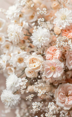 an arrangement of white and pink flowers