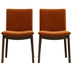 two orange chairs sitting next to each other