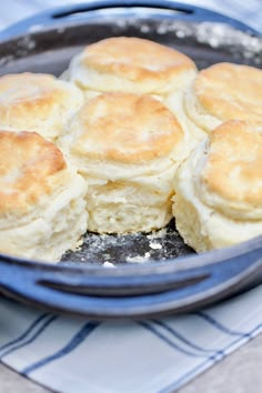 some biscuits are in a blue bowl on a table