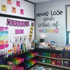 a classroom with lots of colorful bins on the floor and posters on the wall