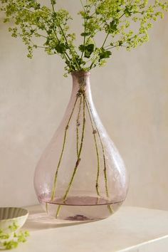 a vase filled with flowers sitting on top of a table