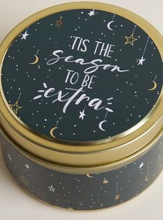 a tin with the words tis the season to be merry written on it