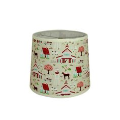 a lamp shade with houses and trees on it