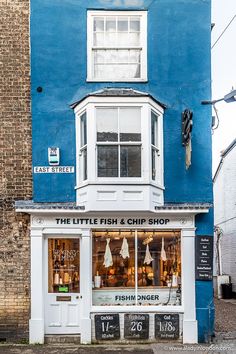 the little fish and chip shop is painted blue