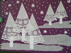 paper cut out trees and snowflakes on a purple background with white crochet