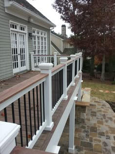 a white railing on the side of a house