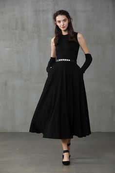 "Winter days do not mean that you need to resign to elegance. Boasting a soft wool-blend construction, this spiral skirt from Linennaive proves that you can be elegant and warm at the same time. Featuring a high waist, a rear zip fastening, a flared style, side pockets and a midi-length. 【Material】 -Wool 87%, Elastane 13% 【Length】 32-33 inches. 【Size】 *SIZE XS length: 32\"/82 cm waist: 26\"/ 66 cm *SIZE S length: 32\"/82 cm waist: 27\"/ 70 cm *SIZE M length: 32\"/82 cm waist: 29/ 75 cm *SIZE L l Winter Evening Midi Skirt, Elegant Winter Party Maxi Skirt, Elegant Asymmetrical Winter Skirt, Long Evening Skirt For Winter, Elegant Long-skirt Winter Dresses, Winter Evening Long Skirt, Elegant Long Winter Dress, Evening Long Winter Skirt, Evening Long Skirt For Winter