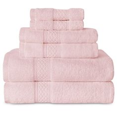 pink towels stacked on top of each other