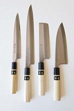 five knives are lined up in a row