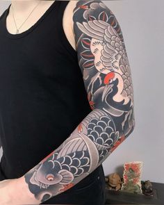 a man with a tattoo on his arm