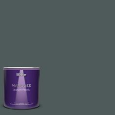 a can of marquee paint on a green background