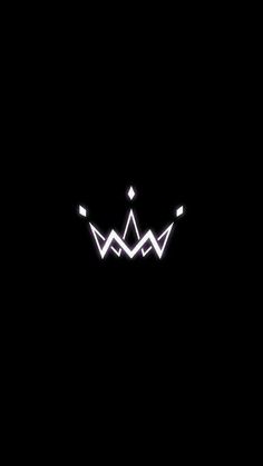 the crown is glowing in the dark with white lights on it's sides and black background