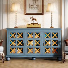 a blue cabinet with mirrored doors in a living room next to a chair and lamp