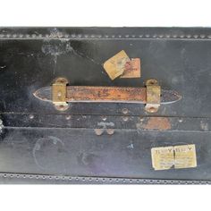 an old suitcase with some tags on it