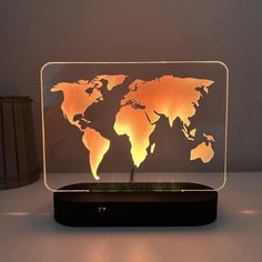 the illuminated world map is displayed on a table